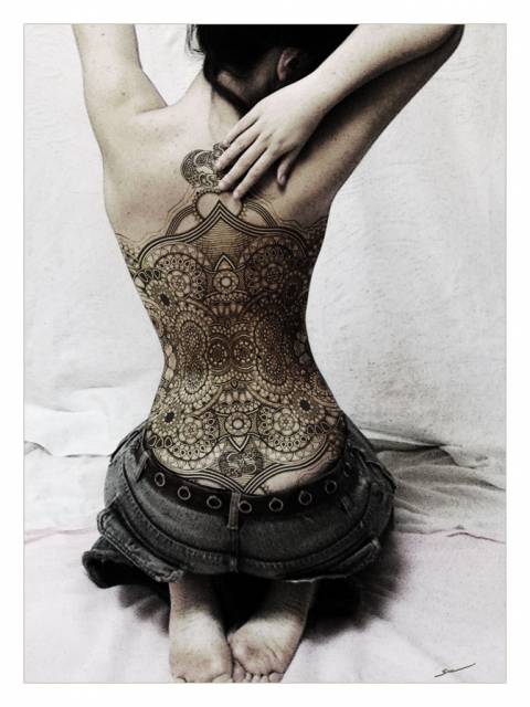 Karale back tattoo.jpg